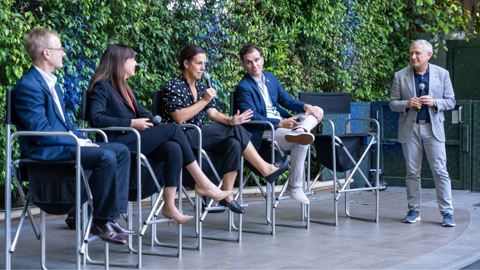 people speaking on a panel